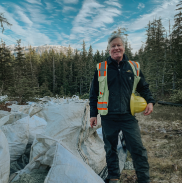 Photo of board member Jack Kreinheder standing at the gravel fly-out site.