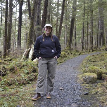 Trail Mix Inc. Director Meghan Tabacek stands on a recently-improved portion of Peterson Lake Trail in Juneau on Feb. 27, 2025. (Photo by Yvonne Krumrey/KTOO).